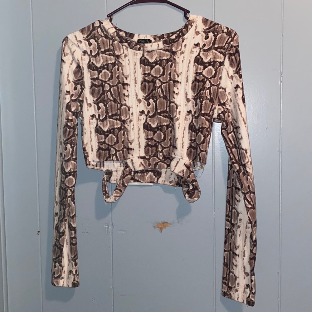 Snake skin pattern, long sleeve, crop top. Has little slits on the sides